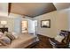 Comfortable bedroom with dark wood floors and access to the bathroom and additional storage at 2700 Las Vegas Blvd # 4109, Las Vegas, NV 89109