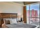 Bedroom with a large window offering city views, natural light, and stylish decor at 2700 Las Vegas Blvd # 4109, Las Vegas, NV 89109