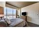 Bedroom with city views, side table, dresser, and a comfortable quilted bed at 2700 Las Vegas Blvd # 4109, Las Vegas, NV 89109