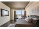 Bright bedroom with dark wood floors, luxurious bed, and stunning city views at 2700 Las Vegas Blvd # 4109, Las Vegas, NV 89109