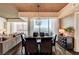 Elegant dining room with floor-to-ceiling windows, hardwood floors, and city views at 2700 Las Vegas Blvd # 4109, Las Vegas, NV 89109