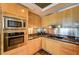 Bright kitchen features stainless steel appliances, wooden cabinets, and granite countertops at 2700 Las Vegas Blvd # 4109, Las Vegas, NV 89109