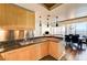 Open concept kitchen featuring an island with granite countertops overlooking dining and living area at 2700 Las Vegas Blvd # 4109, Las Vegas, NV 89109