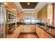 U-shaped kitchen features stainless steel backsplash, granite countertops, and wooden cabinetry at 2700 Las Vegas Blvd # 4109, Las Vegas, NV 89109