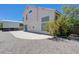 Spacious backyard with concrete patio and exterior view of the two-story home at 3042 Seasons Ave, Henderson, NV 89074