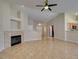 An open living space features a fireplace, tile floors, and a view into the kitchen at 3412 Amish Ave, North Las Vegas, NV 89031