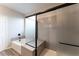 A sleek bathroom features a modern shower, a separate soaking tub, and stylish fixtures at 361 Black Turnstone Ct, Las Vegas, NV 89138