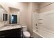 This modern bathroom features a large mirror, toilet, and a tub with shower at 361 Black Turnstone Ct, Las Vegas, NV 89138