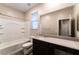 A well-lit bathroom includes a vanity with ample counter space and a tub-shower combination at 361 Black Turnstone Ct, Las Vegas, NV 89138