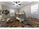 This bedroom has a bunk bed, desk, chair, ceiling fan, and a window for lots of natural light at 361 Black Turnstone Ct, Las Vegas, NV 89138