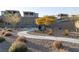 Community park with a paved walkway, seating area, and landscaping at 361 Black Turnstone Ct, Las Vegas, NV 89138
