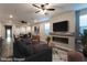 Comfortable living area featuring stylish furniture, a modern fireplace, and a wall-mounted TV at 361 Black Turnstone Ct, Las Vegas, NV 89138