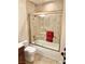 Well-maintained bathroom featuring a shower-tub combination and neutral tile at 3999 Delos Dr, Las Vegas, NV 89103