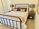 Cozy bedroom featuring a metal bed frame and coordinated pillows at 3999 Delos Dr, Las Vegas, NV 89103
