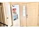 Hallway view into bedroom with an inviting wrought iron bed frame and tiled floors at 3999 Delos Dr, Las Vegas, NV 89103
