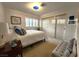 Comfortable bedroom with a large bed, window shutters, and a spacious closet at 3999 Delos Dr, Las Vegas, NV 89103