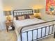 Comfortable bedroom featuring a metal bed frame and coordinated pillows at 3999 Delos Dr, Las Vegas, NV 89103