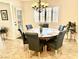 Dining area with wood table, six chairs and neutral décor creates a welcoming space at 3999 Delos Dr, Las Vegas, NV 89103