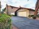 Charming home showcasing a two-car garage and well-manicured landscaping at 3999 Delos Dr, Las Vegas, NV 89103