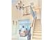 Inviting foyer with staircase and view to living area at 3999 Delos Dr, Las Vegas, NV 89103