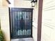 Wrought iron security gate with decorative design at 3999 Delos Dr, Las Vegas, NV 89103