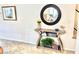 Decorated hallway with stylish console table and round mirror at 3999 Delos Dr, Las Vegas, NV 89103