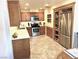 Well-lit kitchen featuring stainless steel appliances and ample cabinet space at 3999 Delos Dr, Las Vegas, NV 89103