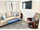 Living room with comfortable seating, TV, and natural light at 3999 Delos Dr, Las Vegas, NV 89103