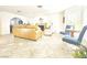 Spacious living room with stone fireplace and travertine flooring offers a relaxed atmosphere at 3999 Delos Dr, Las Vegas, NV 89103