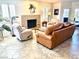 Comfortable living room featuring a stone fireplace and stylish furnishings at 3999 Delos Dr, Las Vegas, NV 89103