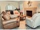Spacious living room with fireplace and open archway at 3999 Delos Dr, Las Vegas, NV 89103