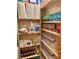 Neatly organized pantry shelves stocked with paper goods, drinks, and household supplies at 3999 Delos Dr, Las Vegas, NV 89103