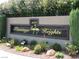 Community sign for Flamingo Heights, surrounded by desert landscaping and green plants at 3999 Delos Dr, Las Vegas, NV 89103