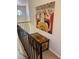 Stairway landing features a decorative chest and artwork, adding a unique touch to the home at 3999 Delos Dr, Las Vegas, NV 89103