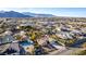 Aerial view of a home with an in-ground pool in a neighborhood near the mountains at 4245 N Campbell Rd, Las Vegas, NV 89129