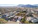 Aerial view of a home in a neighborhood with palm trees and desert landscaping at 4245 N Campbell Rd, Las Vegas, NV 89129