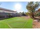 Backyard with a small putting green, trees, and an open structure offer outdoor relaxation at 4245 N Campbell Rd, Las Vegas, NV 89129
