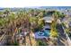 Backyard pool with jacuzzi and covered patio surrounded by palm trees at 4245 N Campbell Rd, Las Vegas, NV 89129