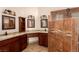 Modern bathroom with dual sinks, granite countertops, and a stylish tiled shower offering a luxurious experience at 4245 N Campbell Rd, Las Vegas, NV 89129