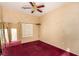 Cozy bedroom with carpet, a ceiling fan, and a view to the adjacent room at 4245 N Campbell Rd, Las Vegas, NV 89129