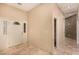 Light and airy entryway boasts tile floors, sidelight window and neutral paint at 4245 N Campbell Rd, Las Vegas, NV 89129