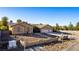 Single-story home featuring a three-car garage, desert landscaping, and attractive architectural details at 4245 N Campbell Rd, Las Vegas, NV 89129