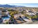 Desert home in suburban neighborhood features a private pool, mature landscaping, and mountain views at 4245 N Campbell Rd, Las Vegas, NV 89129