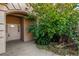 Inviting front entrance with decorative door, lush landscaping, and stone accents creating curb appeal and charm at 4245 N Campbell Rd, Las Vegas, NV 89129