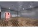 Open floor plan, featuring wood flooring and an adjacent vibrant bathroom for convenience and accessibility at 4245 N Campbell Rd, Las Vegas, NV 89129