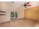 Bright living room with tile floors, a ceiling fan, and sliding doors leading to outdoor space at 4245 N Campbell Rd, Las Vegas, NV 89129