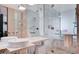 Bathroom featuring double sinks, marble counters and tiles, and a glass shower at 4381 W Flamingo Rd # 3007, Las Vegas, NV 89103