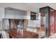 Close up of a stainless steel kitchen with an island counter and modern fixtures at 4381 W Flamingo Rd # 3007, Las Vegas, NV 89103