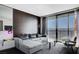 Bright living room with a sectional sofa, city view and modern decor at 4381 W Flamingo Rd # 3007, Las Vegas, NV 89103