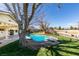 Inviting backyard pool with diving board and well-maintained landscaping at 4530 W Maulding Ave, Las Vegas, NV 89139